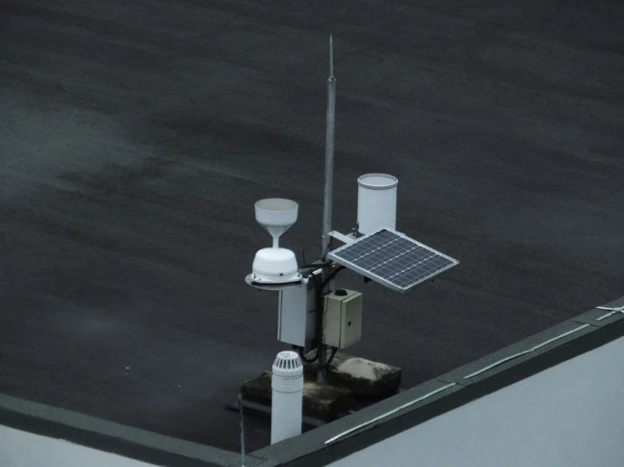 a solar panel mounted to the side of a building